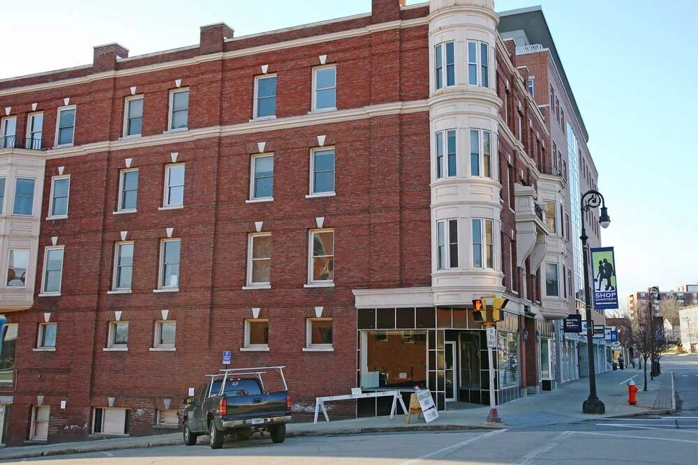 Brick exterior and Queen Anne Oriel tower of the Endicott Hotel, a historic 1894 landmark in downtown Concord, New Hampshire